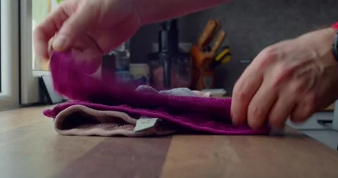 Man hands folding a kitchen towel after washing Stock Footage 264584742
