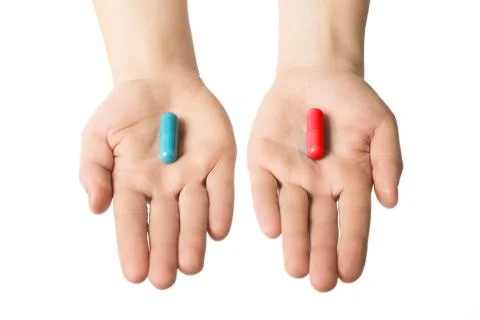 Man hands giving two big pills. Blue and red. Make your selection. Health o.. Stock Photos