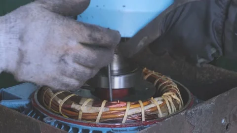 Man hands in gloves assemble winch motor after repair Stock Footage