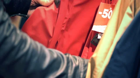 Man Hands Going Through Discount Items In The Clothing Shop Stock Footage 65764289