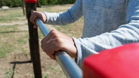 Man Hands Grabbing And Holding An Iron Bar Stock Footage 276312378