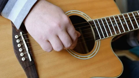 Man hands the guitar Stock Footage 62992237