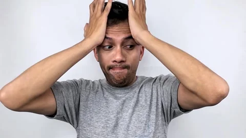 Man with hands on head, stressed and worried expression. Stock Footage 315234977