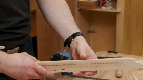 Man hands hold jetliner model insert wing into gap and fixes 스톡 동영상 127374666