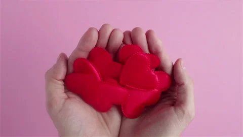 Man hands hold many red heart shapes in hands close up happy valentines day Stock Footage 121668759