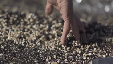 Man Hands Holding And Relase Small Stones In Hands On Beach Stone Background Stock Footage 80383793
