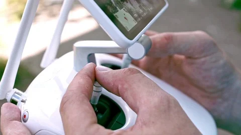 Man hands holding a control panel drone. Monitor and control panel drone Stock Footage 78417520