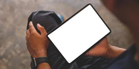 Man hands holding digital tablet with white screen. Foto stock