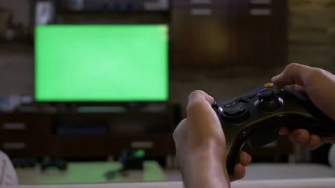 Gamer using vr glasses and controller to play video games. Man with virtual  reality goggles holding joystick in front of computer, playing online game.  Player having fun with games Stock Photo 