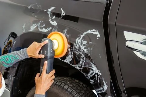 Man hands holding the work tool polish the car.Buffing and polishing car. Stock Photos