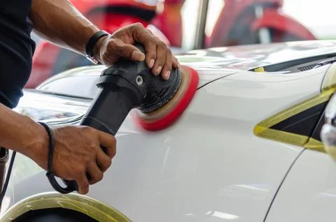 Man hands holding the work tool polish the car.Buffing and polishing car. C.. Stock Photos