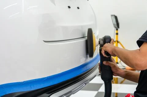 Man hands holding the work tool polish the car.Buffing and polishing car. C.. Stock Photos