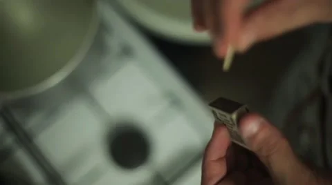 Man hands ignite match, hit on matchbox focus in. Ignition gas stove focus in Stock Footage 60374253