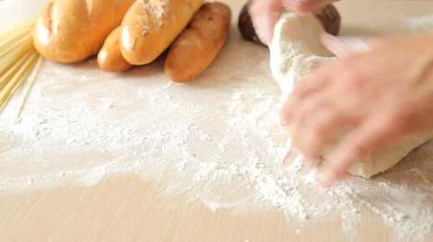 Man hands kneading dough in flour on table. Stock Footage 65562910