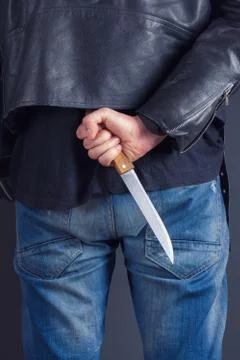 Man hands with knife Stock Photos