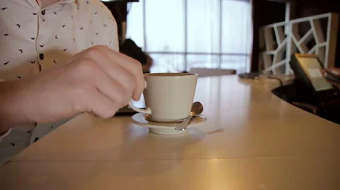 Man hands with latte on a wood table 動画素材 58912725