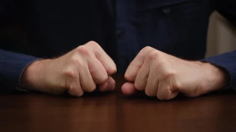 Man hands, lying on the table, slowly clench into fists. close-up. front view. Stock-Footage 301592455
