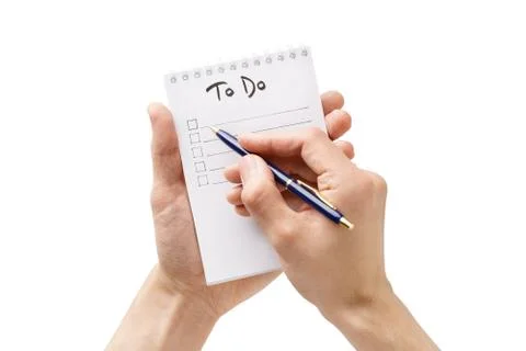Man hands making a to-do list in a notebook. Isolated. Stock Photos
