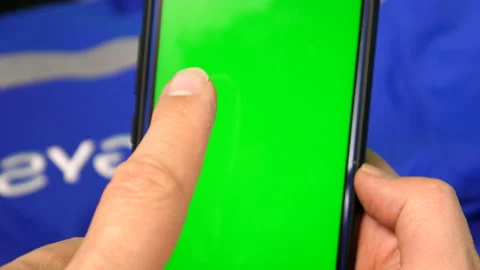 Man hands manipulating chroma cell phone Stock Footage 232450197
