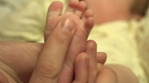 Man Hands Massaging Small Newborn Baby Feet. Closeup. 4K UltraHD, UHD Stock Footage 49270194