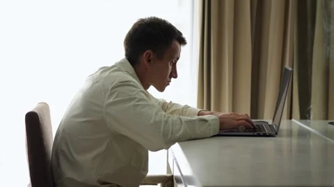 Man hands move rapidly on keyboard while eyes fixed on screen Video stock 302153345