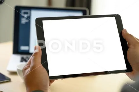 Man hands multitasking man using tablet close up close up working in office Stock Photos