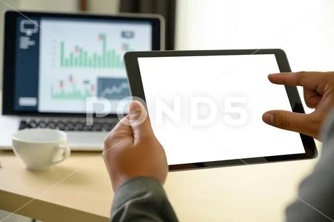 Man hands multitasking man using tablet close up close up working in office Stock Photos