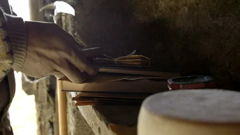 Man hands open a book with a letter inside. Backlights. Slow motion 4K Stock Footage 300577006