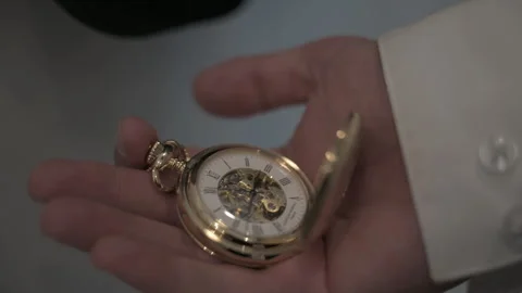 Man hands open gold pocket watch Video stock 246252948