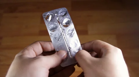 Man Hands Opening A Blister Pack And Taking A Pill, Drugs, Medical Point Of View Stock Footage 41846861