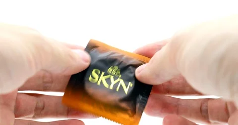Man hands Opening A Condom Package 스톡 동영상 118267199