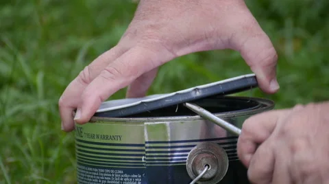 Man hands opening paint can. Stock Footage 58912693