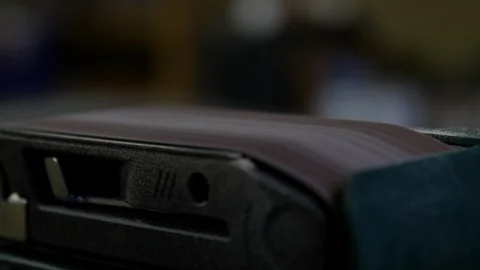 Man hands operating automatic sanding machine. cabinetmaker craftsman making lux Stock Footage 127214520