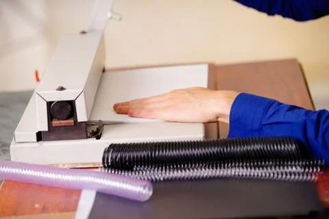 Man hands over a binder using for binding documents with plastic ring binder Stock Photos