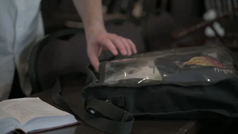 Man hands packing bag in synagogue close up Stock Footage 246253174