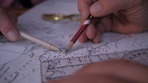 Man hands with pencil and ruler on  sea map chooses a route  Stock Footage 101728803