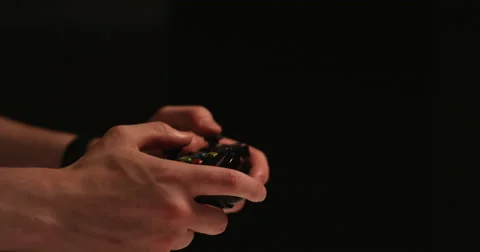 Man hands playing video games- shoots rapidly with controller - isolated with Stock Footage 67869878
