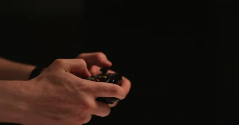 Man hands playing video games- 120fps slow motion- isolated with copy space Stock Footage