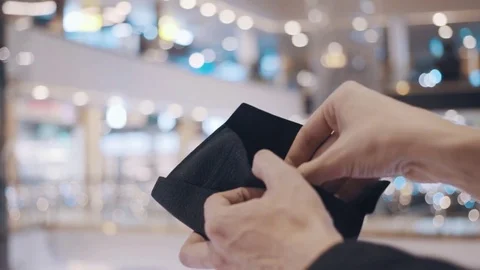 Man hands pulls out stiker with red SALE inscription from empty wallet. After Stock Footage 69957691
