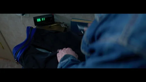 Man hands put passport and books into bag near digital clock Видео 320453726