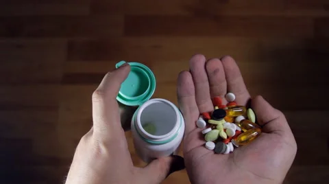 Man Hands Putting Back Pills In A Bottle, Medical, Abuse, Drugs, Point Of View Stock Footage 41847028