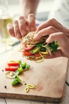 Man hands with sandwich Stock Photos