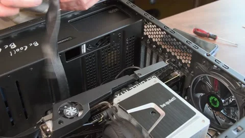 Man hands with screwdriver assemble CPU cooler with NVidia GeForce graphics card Stock Footage 151923217