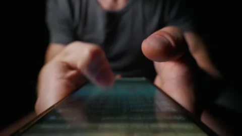 Man Hands Scrolling Through Feed on Smartphone Screen in Dark Room Stock Footage 339366335