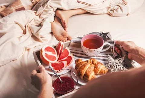 Man hands with service tray with breakfast Stock Photos