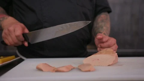 Man hands сhef hold knife want cut foie gras knife raw lunch condiment Stock Footage 103288818