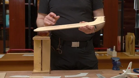 Man hands show outdated passenger aircraft model fuselage 스톡 동영상 126895495