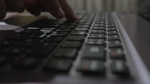 Man hands slow typing on a laptop computer keyboard. Stock Footage 233708322