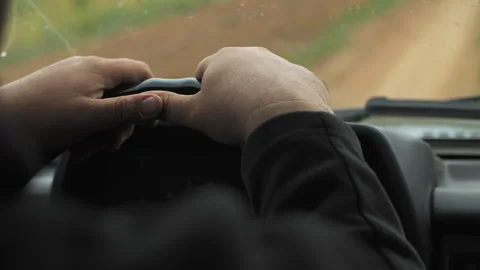 Man hands on the steering wheel of an suv Video stock 280649101