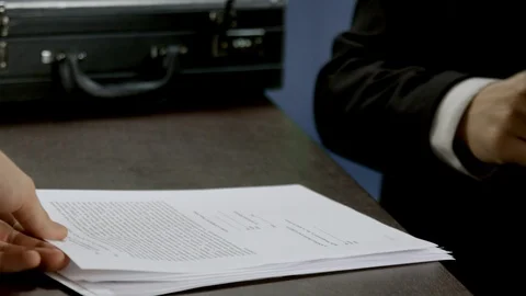 Man hands at table with suitcase make signature application and secretary hand Stock-Footage 103260535